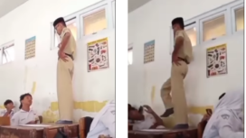 Diduga terdengar suara siulan, seorang oknum guru naik di bangku kelas, lalu menendang kepala siswanya, berakhir damai. Tangkap layar video Instagram@kodil007