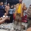 Warga menggiring dua oknum polisi di balai desa Petubg, Panceng, Gresik, Minggu malam 16 Agustus 2026. Foto: Instagram@gresiksumpek.id